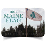 Small simulated plastic gift card with the 1901 Maine Flag logo in dusty teal against pine trees with Original Maine flag blowing in the wind. Card says at bottom Gift Certificate. This is an email gift certificate.